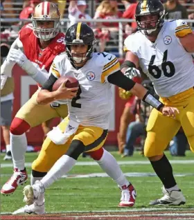  ??  ?? Quarterbac­k Mason Rudolph scrambles for yardage against the 49ers Sunday at Levi’s Stadium in Santa Clara, Calif.