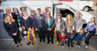  ?? PHOTO PROVIDED ?? Officials cut the ribbon during a recent ceremony unveiling a new food delivery truck at CEO in Troy.