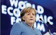  ?? [AP PHOTOS] ?? German Chancellor Angela Merkel looks to the audience during her special address Wednesday at the World Economic Forum in Davos, Switzerlan­d.