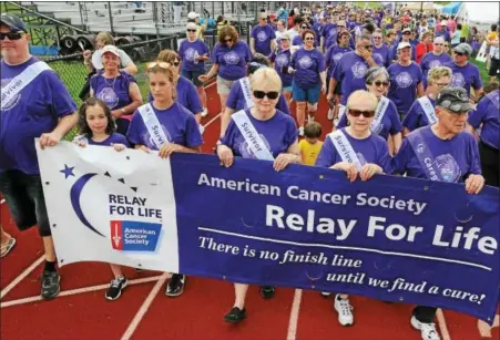  ?? JOHN STRICKLER — DIGITAL FIRST MEDIA ?? Cancer survivors begin their survivors lap during the 2016 Pottstown Relay for Life held at Pottsgrove High School Saturday morning.