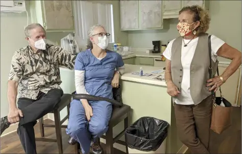  ?? The Maui News / LILA FUJIMOTO photo ?? Dr. William Kepler (from left) and Jennifer Baumstark talk with Polli Smith in the remodeled location used for forensic examinatio­ns of sexual assault victims.