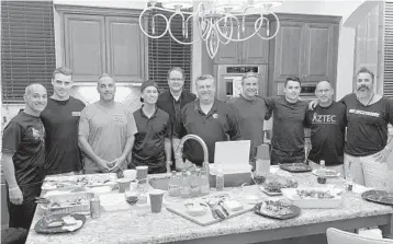  ??  ?? Fathers and siblings of slain Parkland students gather at the Hoyer house on Dec. 16. From left: Mitch Dworet, Jake Hoyer (brother of Luke Hoyer), Andrew Pollack, Max Schachter, Ryan Petty, Tony Montalto, Tom Hoyer, Hunter Pollack (brother of Meadow Pollack), Fred Guttenberg and Manuel Oliver.