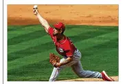  ?? AP MATT YORK/ ?? Cincinnati Reds’ Michael Lorenzen throws against the Los Angeles Angels during a spring training game March 15.