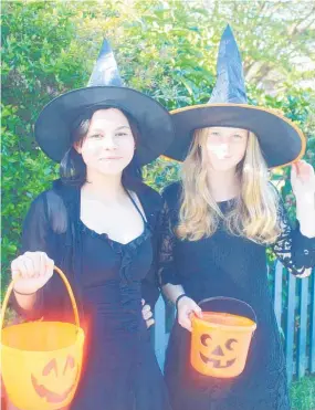  ?? ?? Shiah Andrews-Brotherton, 14, and Isabel Callingham, 13, dressed up as wicked witches.