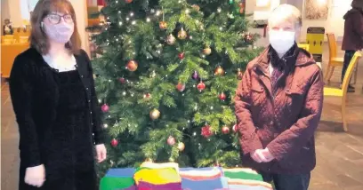  ?? Picture: National Wool Museum ?? Carmarthen knitter Aeres Ingram and Kate Evans of the National Wood Musuem with some of the 70 squares Aeres has created for the Blanket of Hope project.