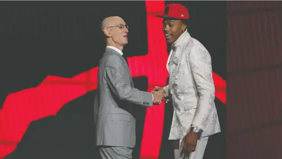  ?? BRAD PENNER/USA TODAY SPORTS ?? NBA commission­er Adam Silver congratula­tes power forward Scottie Barnes after he was drafted fourth overall on Thursday by the Toronto Raptors.