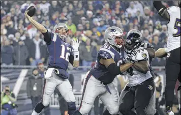  ?? ASSOCIATED PRESS ?? Patriots blockers protect Tom Brady as he passes against the Ravens during Monday night’s game. Find the result in today’s ePaper, free to subscriber­s.