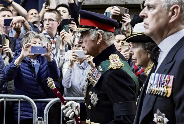  ?? PHOTO: REUTERS ?? Sombre walk . . . King Charles, Princess Anne and Prince Andrew, Duke of York, follow the hearse carrying the coffin of the Queen on the Royal Mile in Edinburgh yesterday.