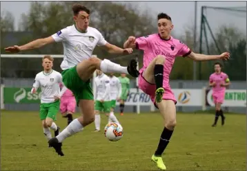  ??  ?? Dean George of Wexford F.C. battling for possession with Cabinteely full-back Karl Byrne.