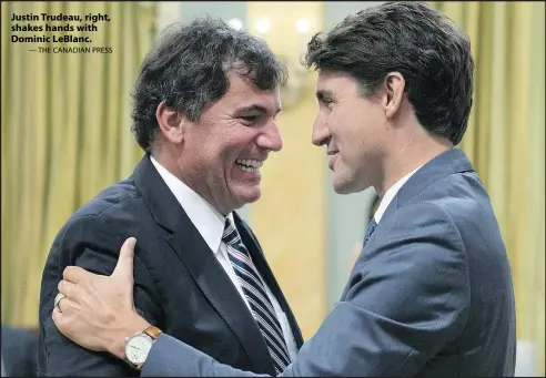  ?? — THE CANADIAN PRESS ?? Justin Trudeau, right, shakes hands with Dominic LeBlanc.