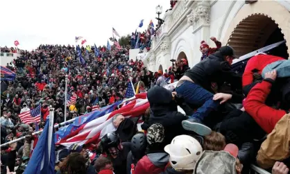  ?? Photograph: Shannon Stapleton/Reuters ?? Pro-Trump protesters storm the US Capitol a year ago.