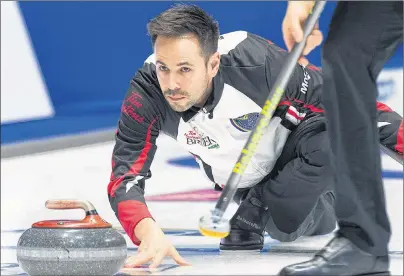  ?? CP PHOTO ?? Ontario skip John Epping releases a rock as they play Saskatchew­an Wednesday at the Tim Hortons Brier in Regina.