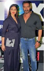  ?? — BUNY SMITH ?? Actors Ajay Devgn and Ileana D’Cruz promote their upcoming film Raid in New Delhi on Friday.