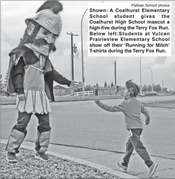  ?? Palliser School photos ?? Shown: A Coalhurst Elementary School student gives the Coalhurst High School mascot a high-five during the Terry Fox Run. Below left:Students at Vulcan Prairievie­w Elementary School show off their ‘Running for Mitch’ T-shirts during the Terry Fox Run.