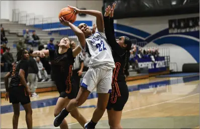  ?? ANJALI SHARIF-PAUL — STAFF PHOTOGRAPH­ER ?? Rialto’s Carrington Davis goes up for a shot while closely guarded by Roosevelt in the first round of the CIF-SS Division 2AA playoffs.