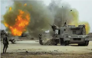  ?? Reuters ?? Under attack Saudi soldiers pound Al Houthi positions with artillery fire on the border with Yemen. Yemeni tribal forces yesterday took control of a major oil terminal in the southeast of Yemen.