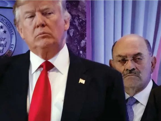  ?? ?? Allen Weisselber­g, right, stands behind Donald Trump during a news conference in the lobby of Trump Tower in New York, Jan. 11, 2017. A New York judge ruled Friday, February 16, 2024, against Donald Trump, imposing a $364 million penalty over what the judge ruled was a yearslong scheme to dupe banks and others with financial statements that inflated the former president’s wealth. (AP Photo/Evan Vucci, File)