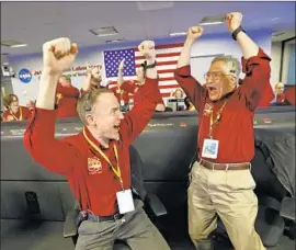  ?? Al Seib Los Angeles Times ?? AFTER a tense few minutes at the Jet Propulsion Laboratory in La Cañada Flintridge, Kris Bruvold, left, and Sandy Krasner hear that InSight landed successful­ly.