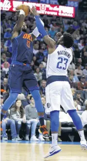  ?? [PHOTO BY SARAH PHIPPS, THE OKLAHOMAN] ?? Dallas guard Wesley Matthews, shown here defending Oklahoma City’s Paul George during the NBA game Dec. 31 between the Oklahoma City Thunder and the Mavericks at Chesapeake Energy Arena, will likely miss the rest of the season.