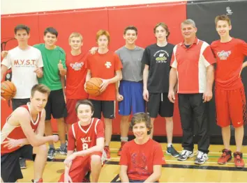  ??  ?? Wayne Lee said the best thing for him is to see a child succeed and be happy. He stands here with the VCI boys jr basketball team. Although he doesn’t coach them, they were all more than happy to pose with him.