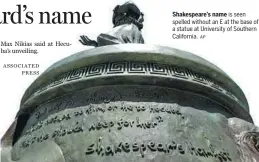  ?? AP ?? Shakespear­e’s name is seen spelled without an E at the base of a statue at University of Southern California.