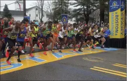  ?? THE ASSOCIATED PRESS ?? In this April 15, 2019, file photo, the elite men break from the start of the 123rd Boston Marathon in Hopkinton, Mass.