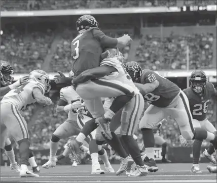  ?? ERIC CHRISTIAN SMITH, THE ASSOCIATED PRESS ?? Houston Texans quarterbac­k Tom Savage (3) is hit by San Francisco 49ers defensive end Elvis Dumervil during Sunday’s game. Savage was injured on the play.