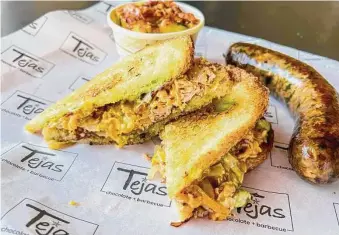  ?? Photos by J.C. Reid / Contributo­r ?? It’s getting to the point that the turkey used on the Smoked Turkey Melt sandwich at Tejas Chocolate & BBQ is more expensive than brisket, according to co-owner Scott Moore.