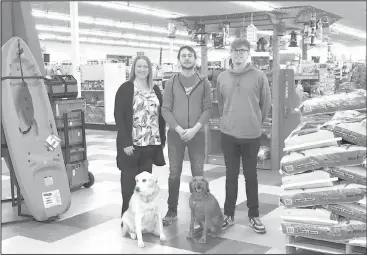  ??  ?? Handy Home & Hardware owner Megan Zarbano (left) pictured with Joel Gortmaker (middle) and Casey Nelson. They’re joined by furry friends Purdy and Zoey.