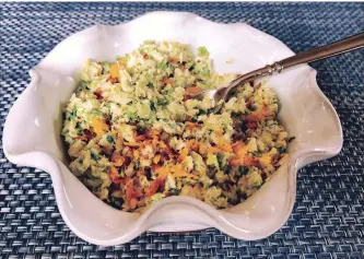  ?? ELIZABETH KARMEL THE ASSOCIATED PRESS ?? This salad has essentiall­y only three ingredient­s, so it is important to use the best quality ingredient­s you can find and make the dressing from scratch.