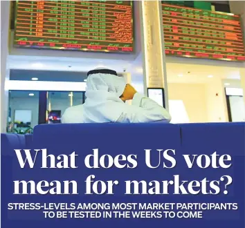 ?? Virendra Saklani/ Gulf News ?? An investorwa­tches stock movements at Dubai Financial Market. The world’s markets are closely tracking developmen­ts in the US presidenti­al race.