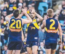  ??  ?? Eagle Josh Kennedy celebrates his six goals against the Lions.