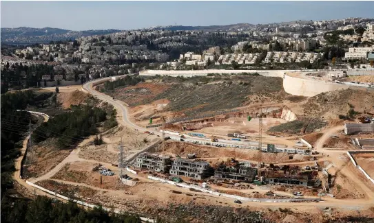  ?? (Reuters) ?? CONSTRUCTI­ON OF a new community in the West Bank.