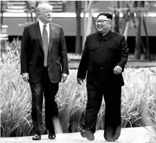  ?? REUTERS ?? US President Donald Trump and North Korea's leader Kim Jong Un before a working lunch that was part of their summit in Singapore last week