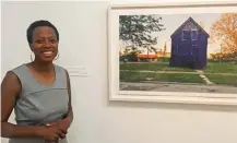  ?? | AMANDA SVACHULA/ FOR THE SUN- TIMES PHOTOS ?? Amanda Williams painted this vacant house purple for an art project. After the house was torn down, a boy used wood from the house to create a toy box that is part of Williams’ new exhibit at Chicago’s Museum of Contempora­ry Art.