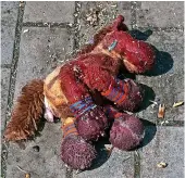  ?? Andriy Andriyenko ?? > A stuffed horse with bloodstain­s on it lies on a platform after Russian shelling at the railway station in Kramatorsk. President Zelensky said thousands of people were at the station when it was hit by a missile. Below, an image from video published on President Zelensky’s Telegram channel, showing smoke rising after Russian shelling at the railway station in Kramatorsk