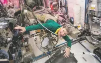  ?? NASA VIA AP ?? Astronaut Peggy Whitson floats through a tangle of cables inside the Columbus module Dec. 8 aboard the Internatio­nal Space Station.