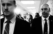  ?? ALEX BRANDON/AP ?? A security detail surrounds EPA Administra­tor Scott Pruitt, center, as he walks to a budget hearing in April.