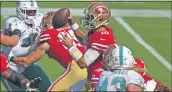  ?? JOSE CARLOS FAJARDO — BAY AREA NEWS GROUP ?? 49ers quarterbac­k Jimmy Garoppolo is pressured while attempting to pass against the Dolphins at the Levi’s Stadium in Santa Clara on Sunday.