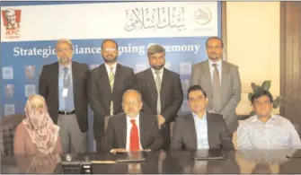  ??  ?? Hasan A. Bilgrami CEO Bank Islami and Raza Pirbhai CEO KFC Pakistan during an accord signing ceremony.