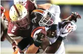  ?? Michael Dwyer/ Associated Press ?? Boston College's Zach Allen (2) tackles Virginia Tech's Travon McMillian during thesecond half of an NCAA college football game on Oct. 7, 2017,in Boston.