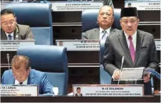  ?? ?? Future expenses: Hajiji tabling the state budget in Kota Kinabalu. — bernama