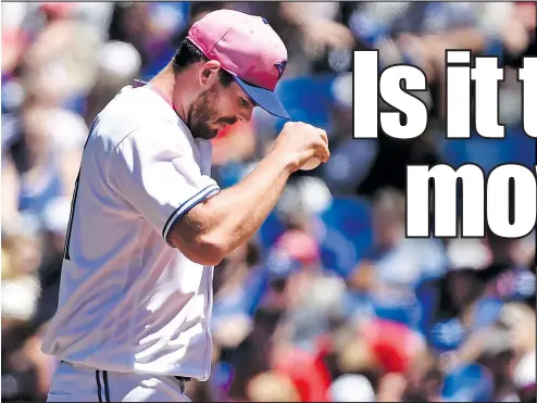  ?? NATHAN DENETTE/THE CANADIAN PRESS ?? Blue Jays pitcher Joe Biagini looks down after giving up a two-run homer to J.D. Martinez of the Red Sox in yesterday’s 5-3 loss.