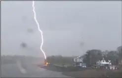  ??  ?? Stormy weather: Lightning strikes the bank of the Thames