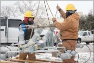  ?? THOMAS RYAN ALLISON — BLOOMBERG ?? Workers repair a power line in Austin, Texas, on Feb. 18, 2021.
