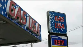  ?? AP PHOTO/TONY DEJAK ?? Gas USA is selling gas for 97.9 cents a gallon Monday in Cleveland.