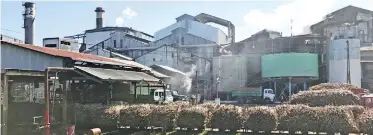  ?? Photo: Charles Chambers ?? Lorries and rail trucks off-load sugar cane at the Lautoka Mill.