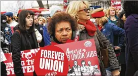  ?? MARTIN / ASSOCIATED PRESS JACQUELYN ?? Betty Shadrick of Albany, N.Y., a member of the United University Profession­s union, rallies Monday outside the U.S. Supreme Court building on behalf of unions. The court was deciding whether states can collect union fees even from non-members.