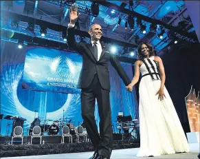  ?? ASSOCIATED PRESS ?? SUSAN WALSH President Barack Obama and his wife, Michelle, appeared Saturday night at the Congressio­nal Black Caucus Foundation’s conference in Washington.