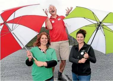  ?? PHOTO: FAIRFAX NZ ?? Helen Neighbour-cone, left, John Reuhman and Jess Jones of the Picton Marlboroug­h Sounds Havelock Visitor Economy Steering Group want Picton to be included in national weather forecasts, as a way of promoting the town.